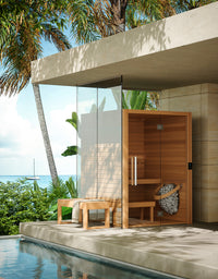 Auroom Cala Glass indoor sauna in tropical setting